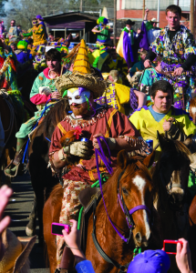 Traditionally costumed riders set out on a Cajun "Courir de Mardi Gras" in Eunice, La. Credit: Philip Gould