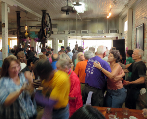 Dancers jam the tiny dancefloor at the Zydeco Breakfast at Cafe Des Amis in Breaux Bridge. Credit: Wendy Lemlin