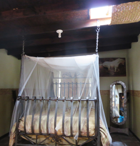 A romantic hanging bed in a guestroom