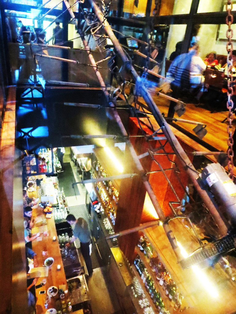 A huge glass-enclosed kinetic sculpture that pays homage to the hard work of the "Braceros" (day laborers) of the mid 1900s is hung between the street and upper levels of the restaurant.