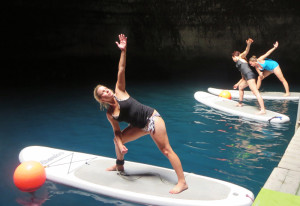 Put your friendship in balance with Stand Up Paddleboard yoga in a 10,000 year old hot spring in Heber, UT Credit: Wendy Lemlin