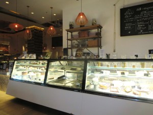 Prepared foods for take home dining are displayed in cases in the Marketplace