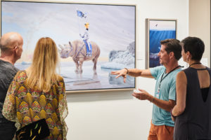 Artist Paul Bond shows some of his magical realism art at the Festival of the Arts credit: Baldemar Fierro