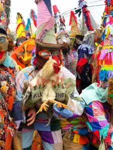 Cajun revelers in in traditional costumes celebrate Mardi Gras in rural towns with a "chicken run"